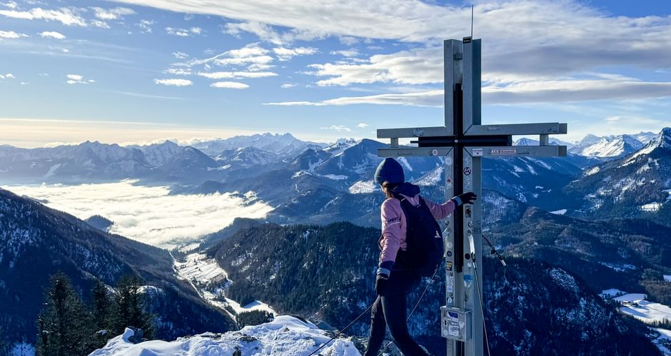 Hiker at the summit cross