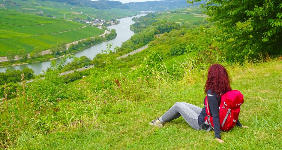 Hiker with backpack and view of the Moselle