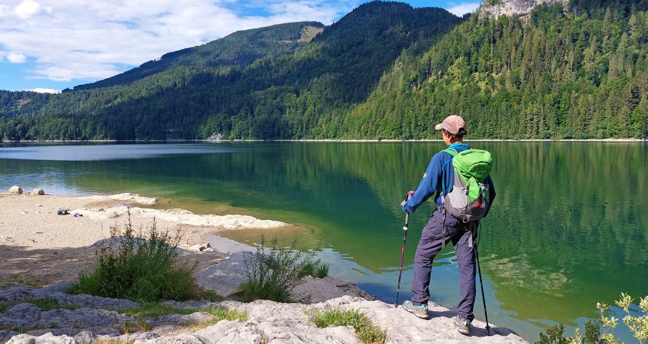 Hiker on the shore of Lake Schwarzensee